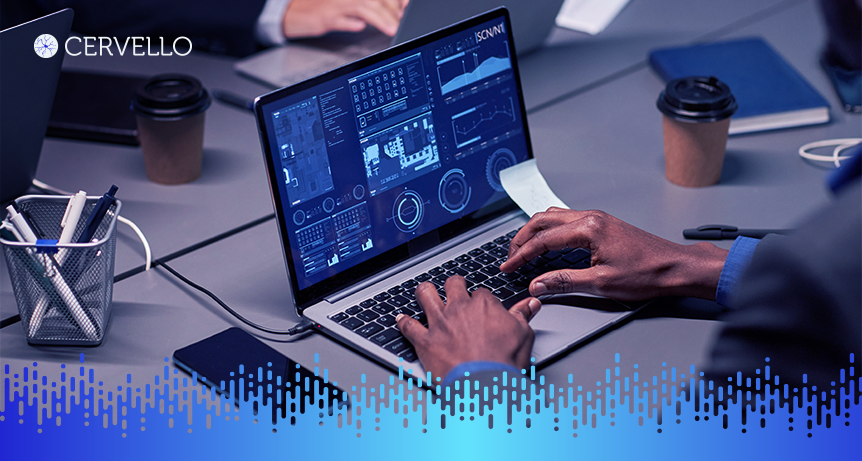 Imagem de pessoas trabalhando em uma reunião de negócios, com foco em um laptop exibindo gráficos e dados para estratégias de redução de custos nas empresas.